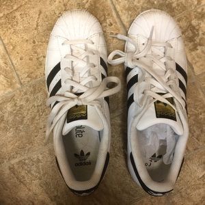 Adidas All-Stars shoes.